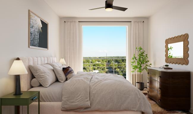 a bedroom with a large window