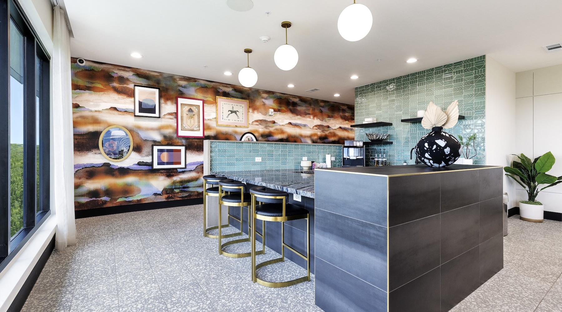 Sophisticated indoor lounge and entertainment space at The Bouldin showcasing modern seating, a large dining table, floor-to-ceiling windows, and sweeping views of downtown Austin from an elevated vantage point.