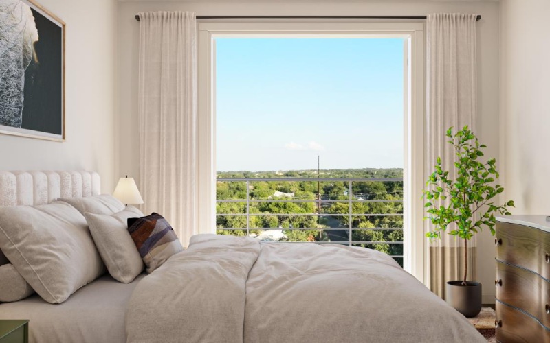 a bedroom with a large window